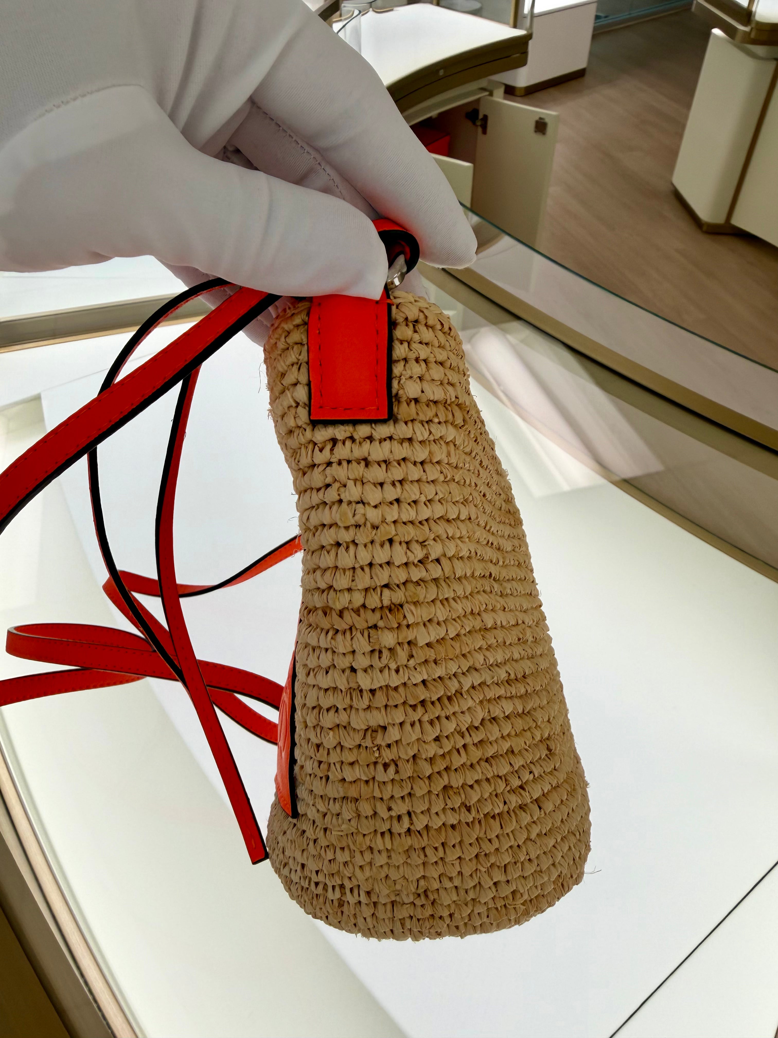 Loewe Slit pochette bag in raffia and calfskin