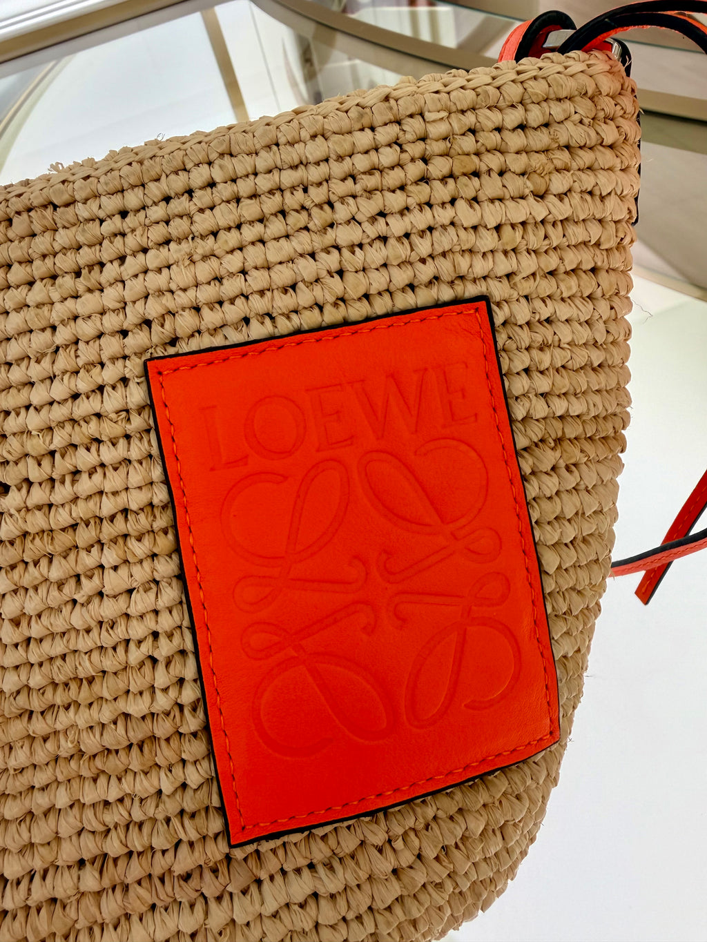 Loewe Slit pochette bag in raffia and calfskin