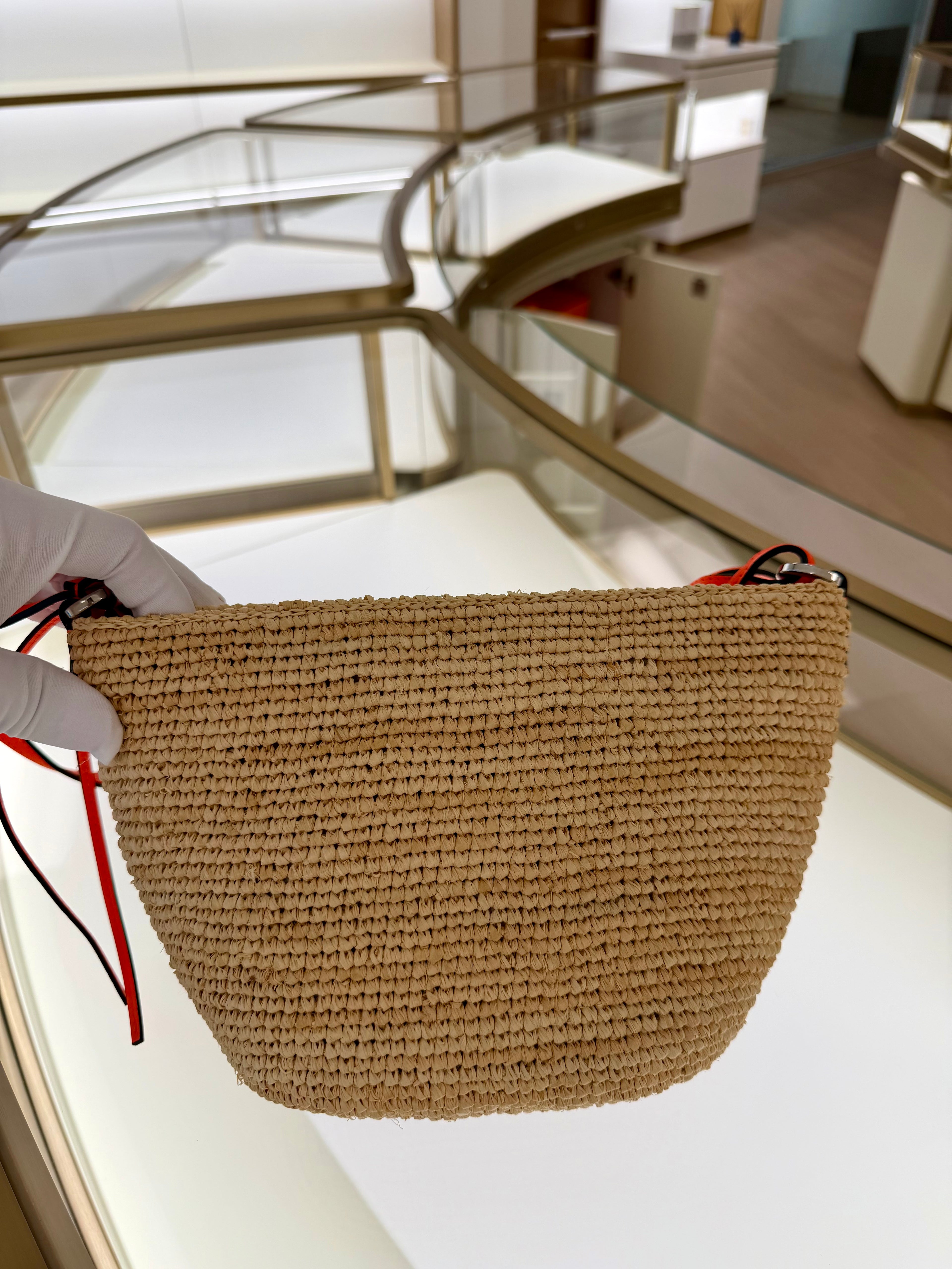 Loewe Slit pochette bag in raffia and calfskin