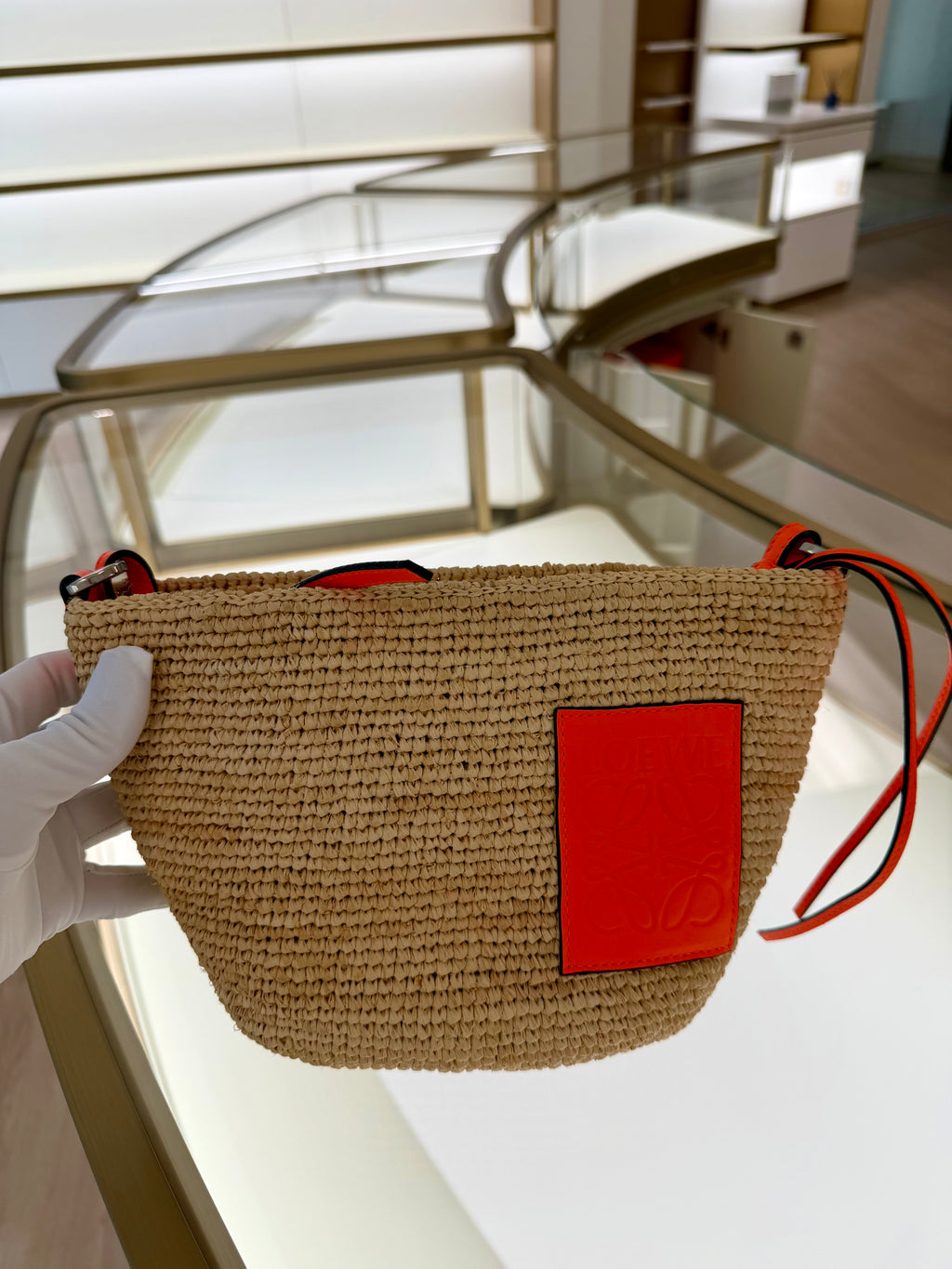 Loewe Slit pochette bag in raffia and calfskin