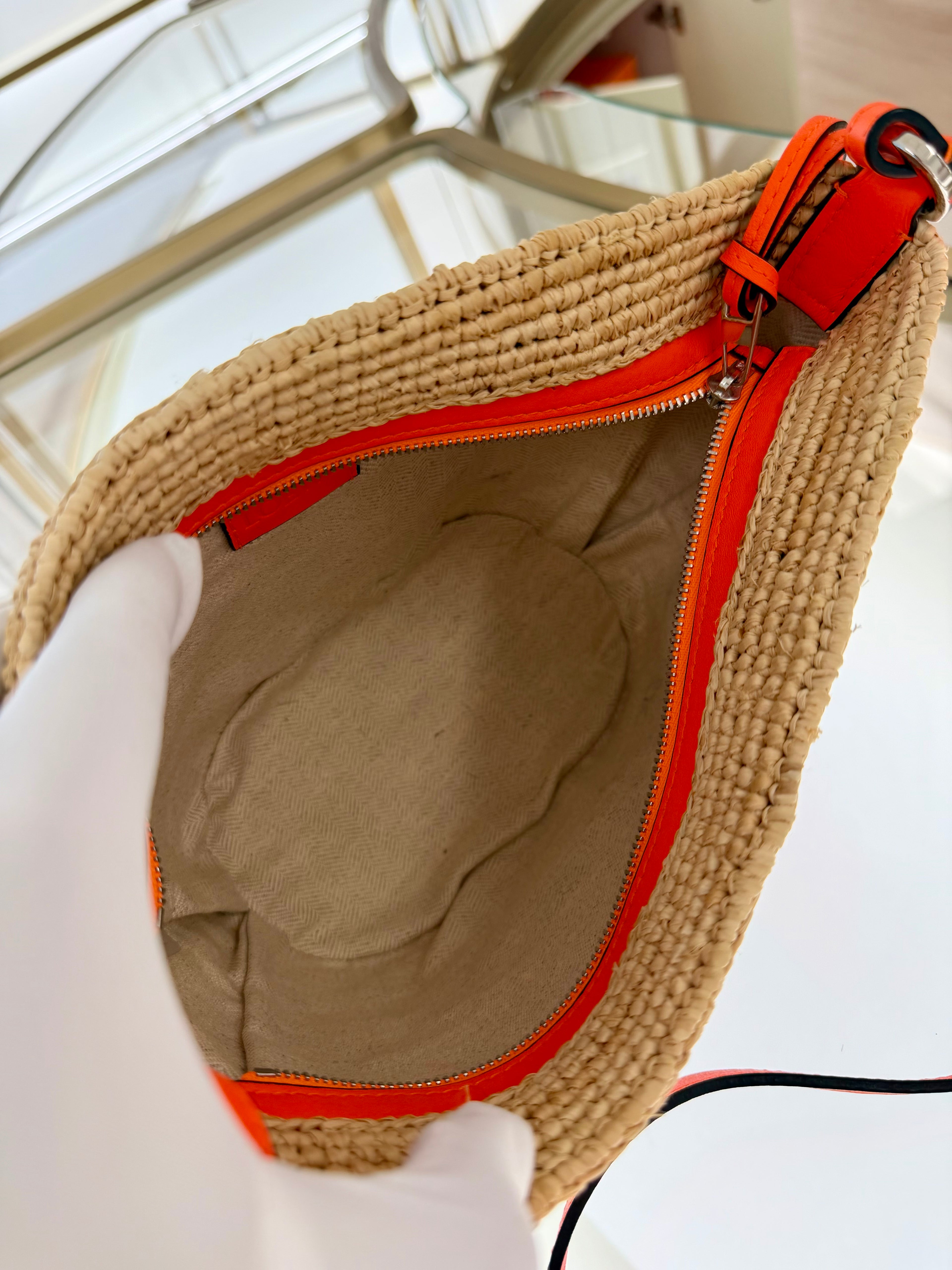 Loewe Slit pochette bag in raffia and calfskin