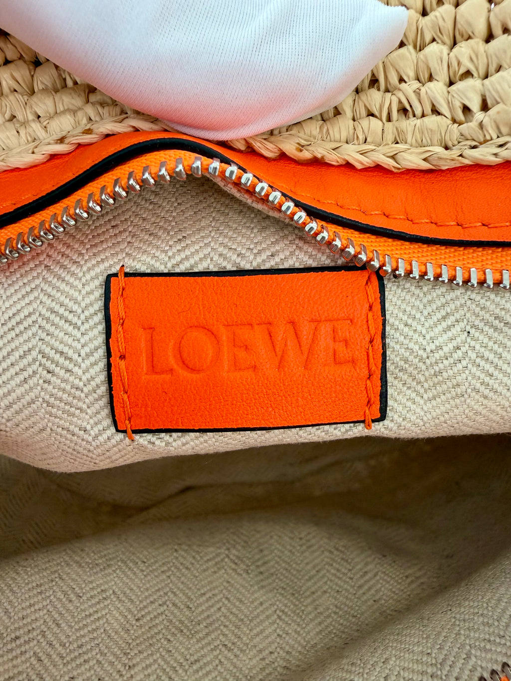Loewe Slit pochette bag in raffia and calfskin