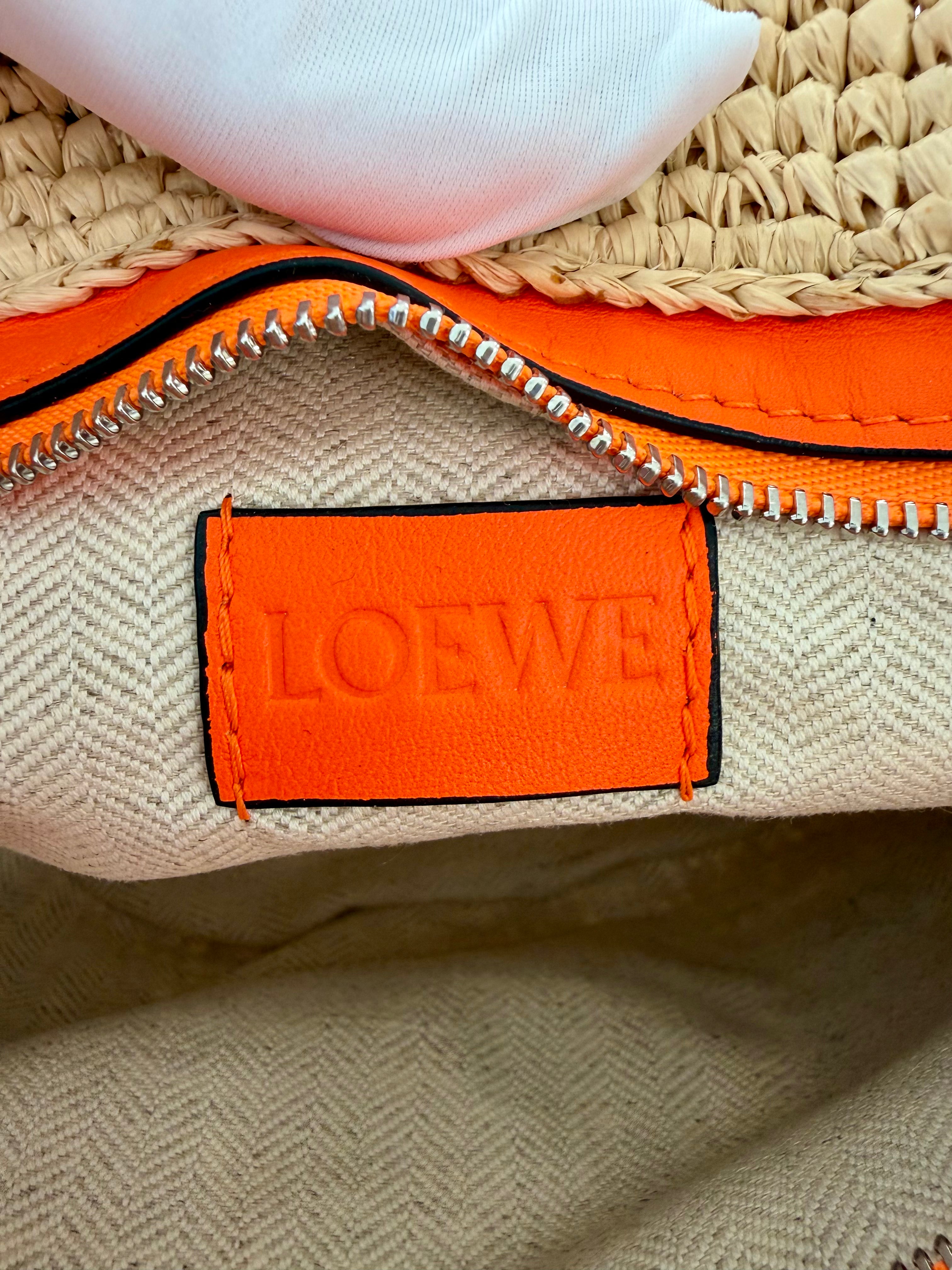 Loewe Slit pochette bag in raffia and calfskin