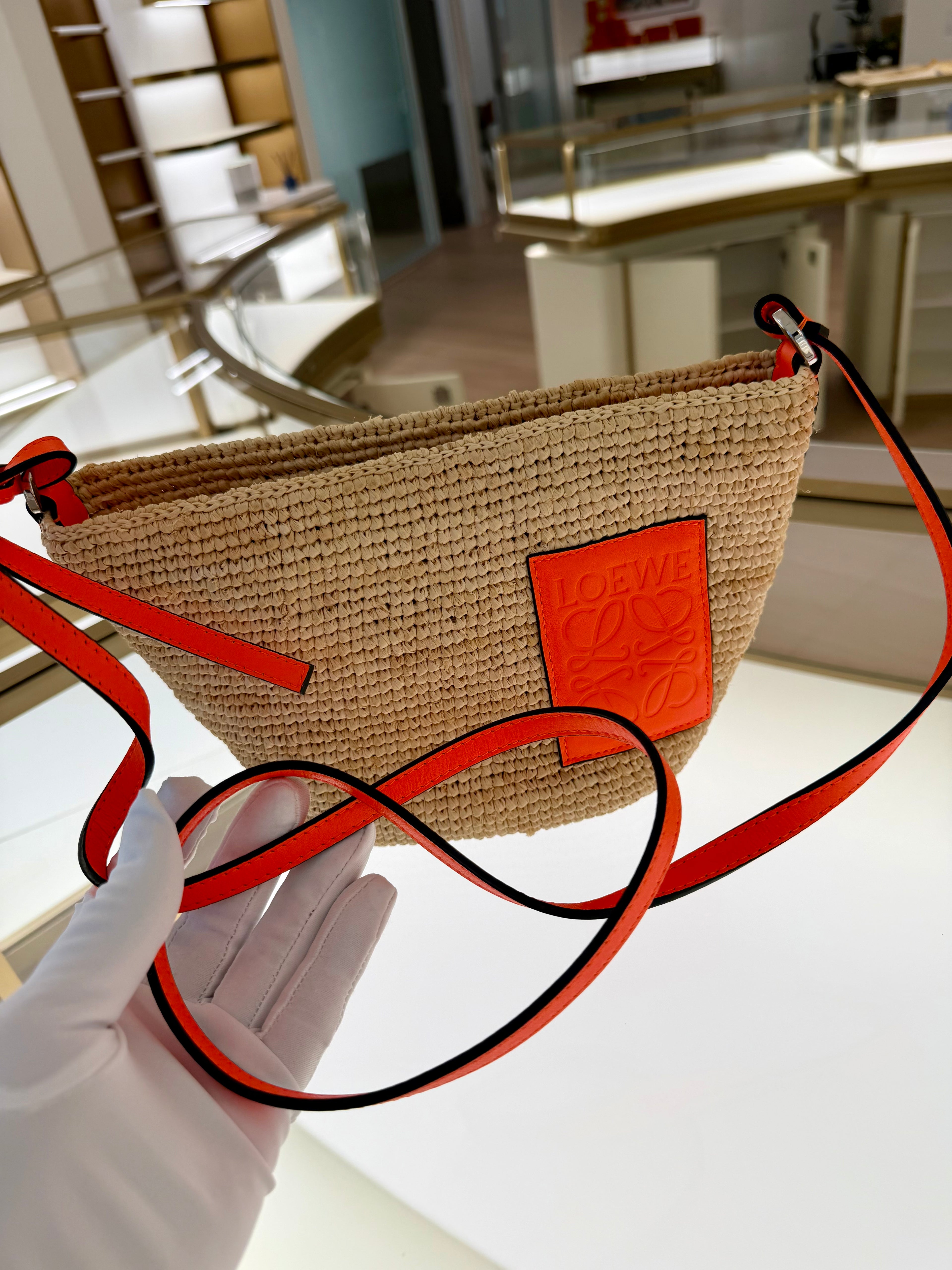Loewe Slit pochette bag in raffia and calfskin